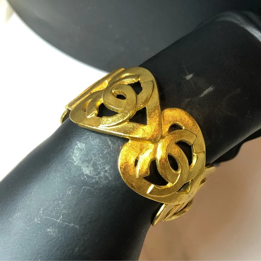 CHANEL Gold Cuff Bracelet with Interlocking CC Open Heart Design
